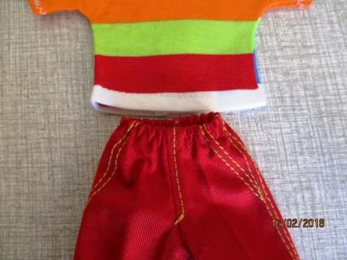 Ken - Barbie - red pants and bright striped T-shirt.