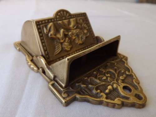 interesting wall container possibly for matches ... of brass !!!