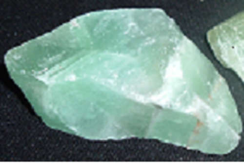 Rough green calcite draws money and prosperity