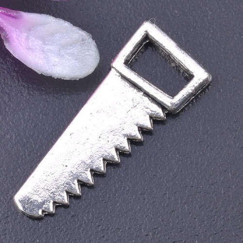 TIBETAN SILVER SAW CHARM
