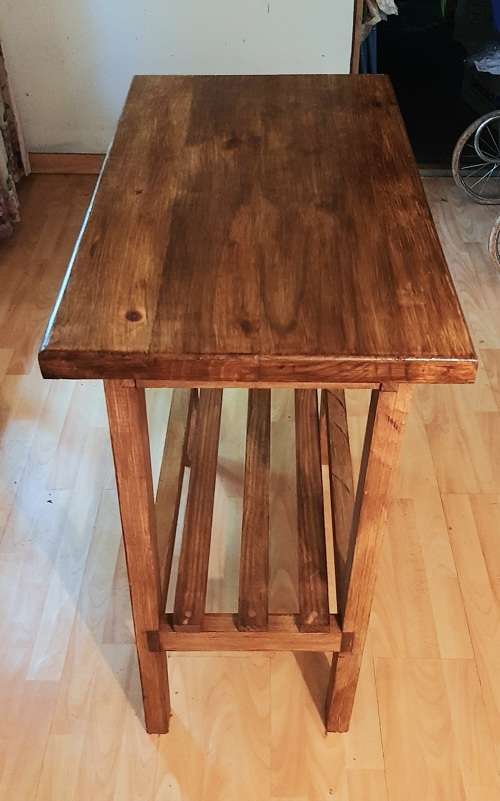 Chopping block table made of stained pine