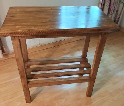 Chopping block table made of stained pine