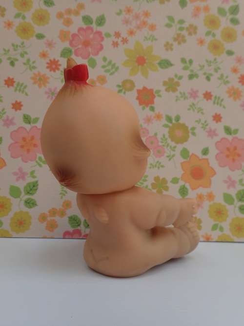 Kewpie Doll Sitting Posture