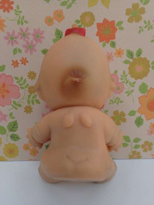 Kewpie Doll Sitting Posture