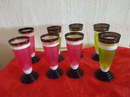 A set of eight colorful tall drinking glasses