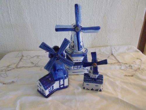 A collection of three blue and white dutch style wind mill ornaments