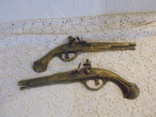 A pair of brass ornamental guns