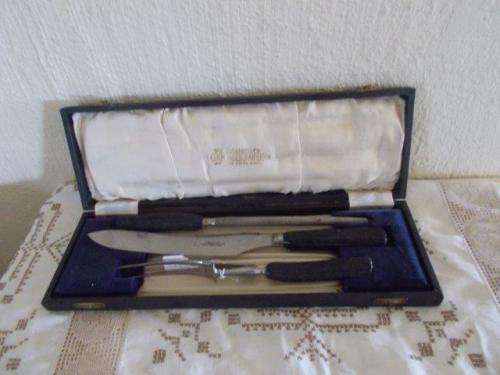 Cased vintage black handled craving set