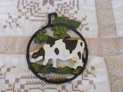 cast iron pot trivet , cow pattern