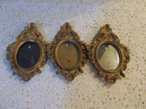Three hard plastic ornate vintage frames