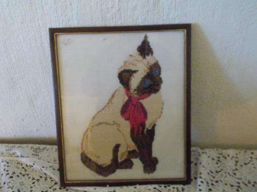 Small framed tapestry of a badge kitten