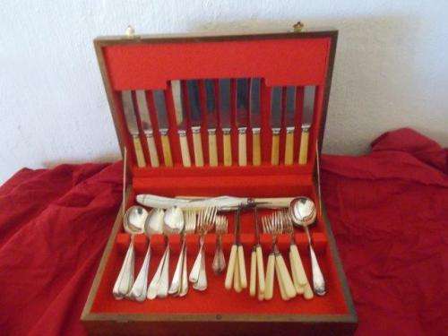 vintage wooden canteen set filled with vintage cutlery