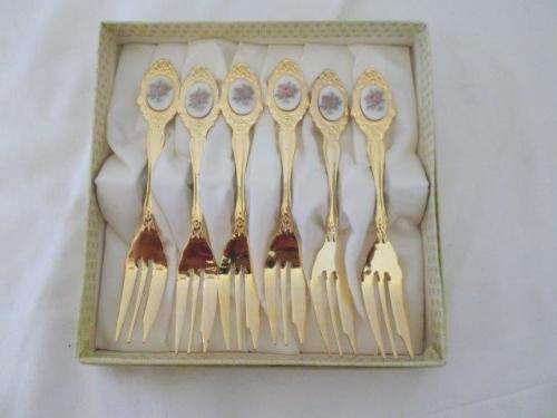 Stunning set of gold plated cake forks with porcelain tops