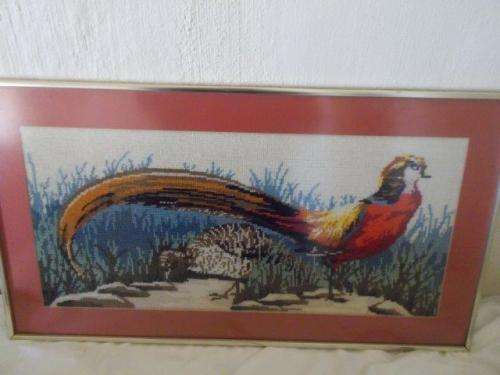 Framed behind glass tapestry of pheasant bird