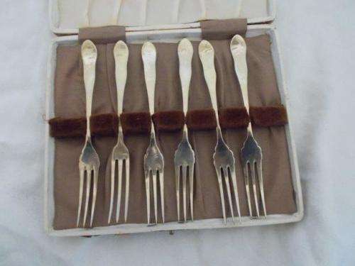 boxed silver plated pickle forks ? or fruit forks