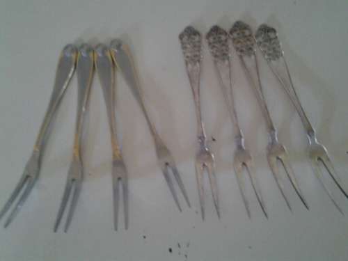 a lot of assorted cocktail forks