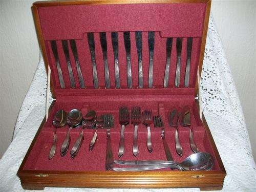 A canteen set of stainless steel cutlery , set incomplete