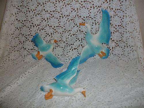 collection of blue ceramic flying ducks