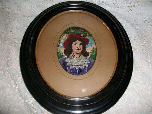 vintage oval black frame with a man taperstry (no 2)