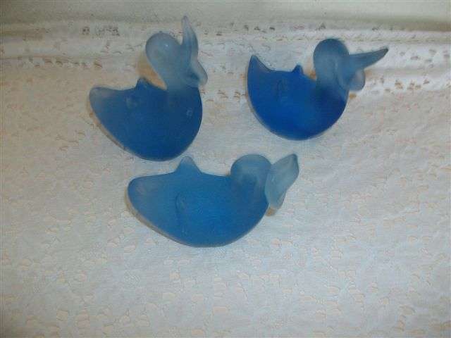Three lovely frosted blue glass ducks