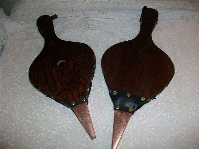 A pair of wooden fire bellows