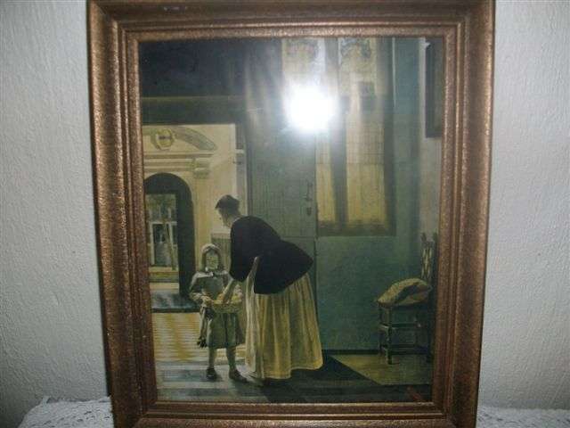 Vintage victorian scence print behind glass