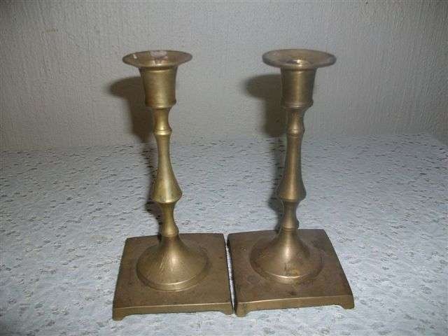 A pair of brass candle sticks
