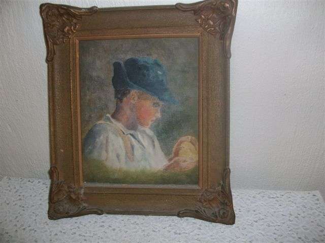 Ornate frame with oil picture on canvass of a boy