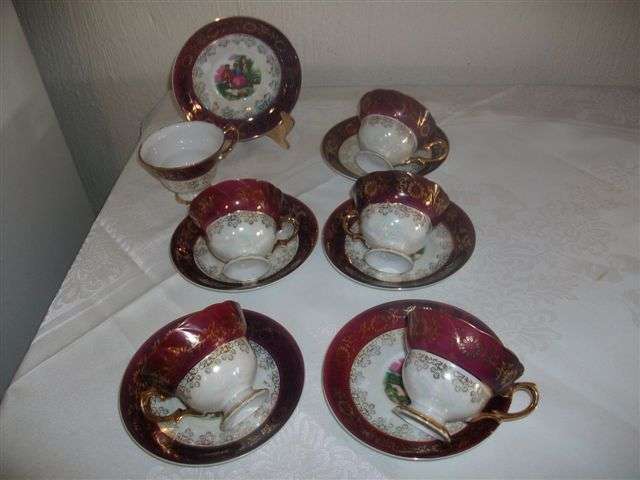Set of six lovely mother of pearl inlay ,romatic scences teacups and saucers