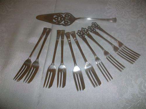 Sliver plated cake lifter and cake forks comb