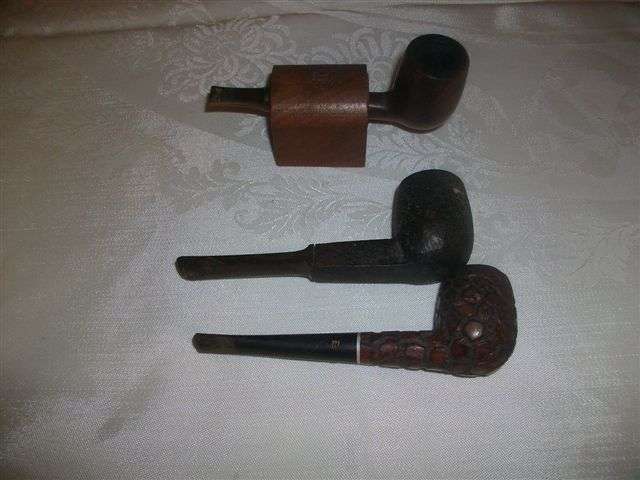 Three asstorted pipes with pipe holder