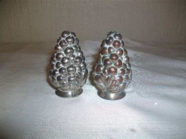 A pair of sliver plated grape salt and pepper set
