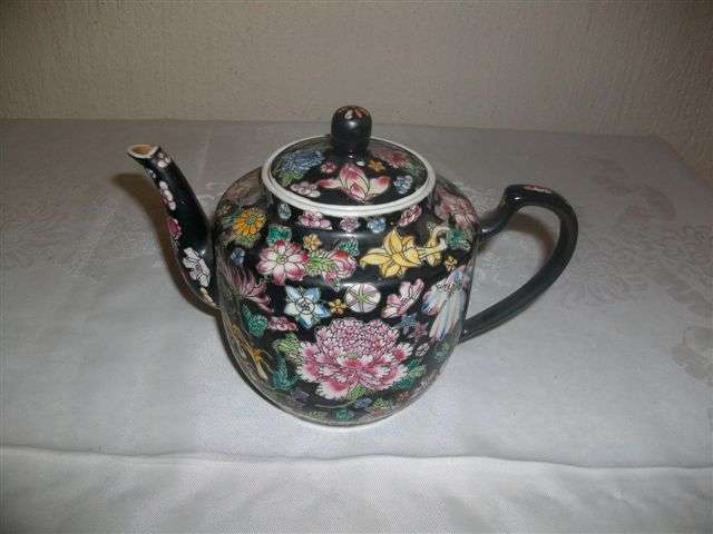 Lovely highly decorated black with flowers oriental tea pot