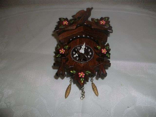 Wonderful miniature black forest style cuckoo clock with key