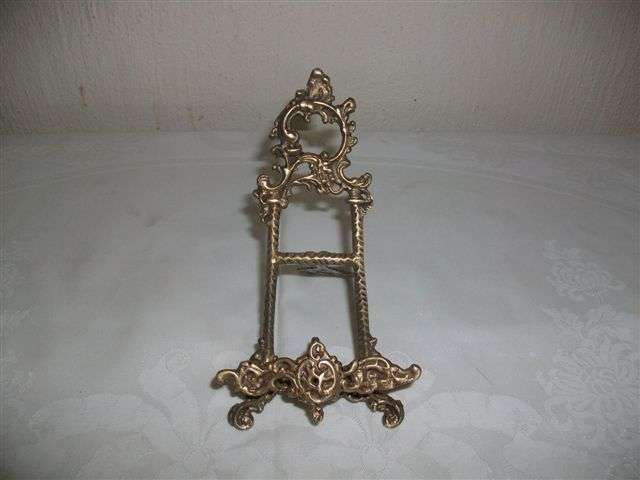 Ornate brass vintage picture frame holder ..?
