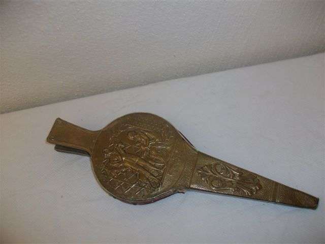 A pair of brass fire bellows