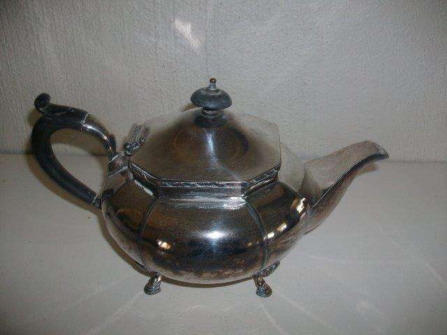 Vintage sliver plated tea pot with black handle and knob