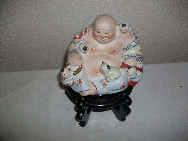 Lovely religious Buddha on stand