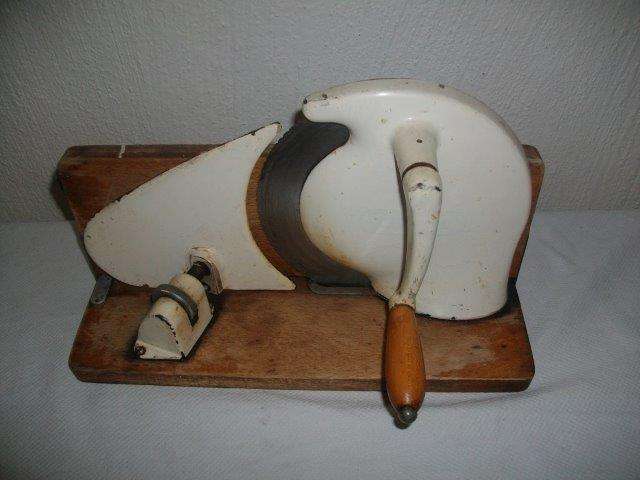 Vintage slicer on wooden board