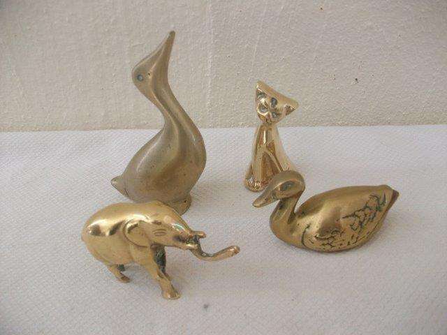 Four assorted small brass animals for the collector