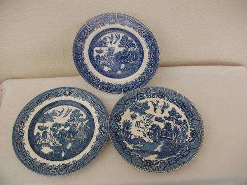 Three lovely blue and white willow pattern style wall plates