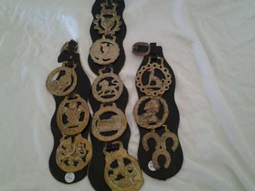 three nice assorted on leather horse brasses