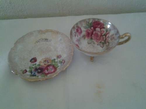 pretty floarl cabinet footed tea cup duo