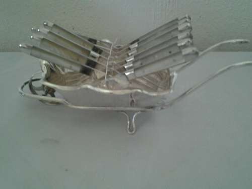 very nice silver plated mother of pearl fruit knifes in silver plated wheel barrow