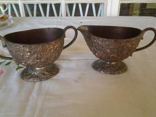 nice copper looking orante floarl pattern metal milk and sugar bowl