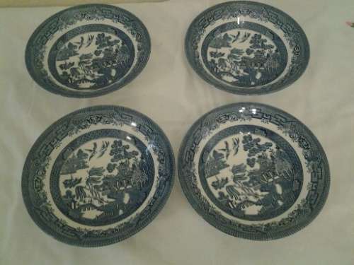 Four lovely blue and white willow pattern soup bowls