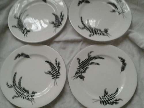 A set of four midnight and day royal albert side plates