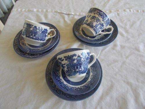 three nice assoreted blue and white willow pattern tea cup trios