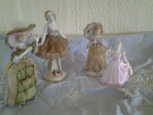 A job lot of four pretty assorted vintage ladies figurines