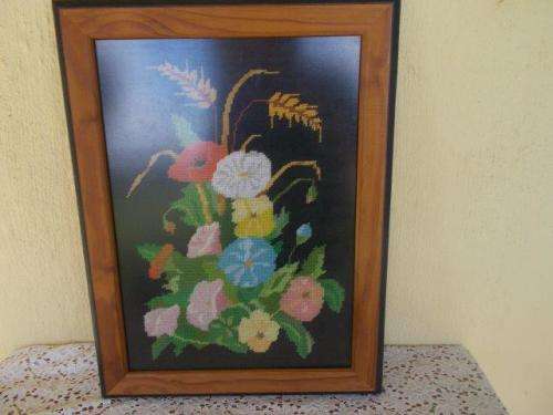 Framed behind glass floarl scene taperstry